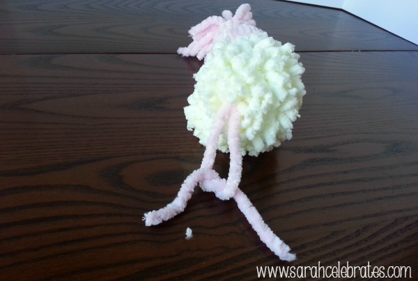 Yarn Snowmen With Hats - Tie strings to secure hat, bottom |Sarah Celebrates