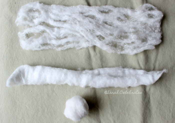 Scare Up a Halloween Wreath for $5! - Make webs out of unrolled cotton balls
